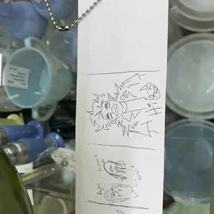 A booth with a strip of paper you can leave notes on