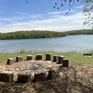Not a mini Stonehenge.  A lakeside fire pit.