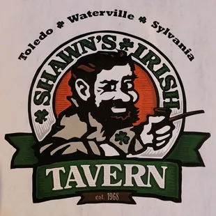 a man with a beard holding a pair of scissors