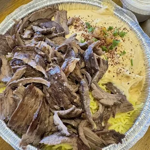 Bowl with beef, rice and hummus