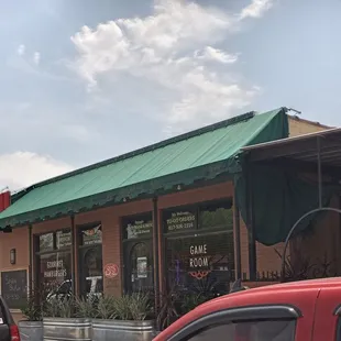 cars parked in front of the restaurant