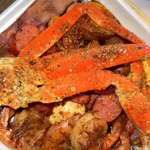 a tray of seafood and potatoes