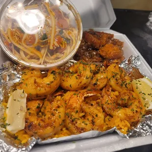a tray of shrimp and pasta