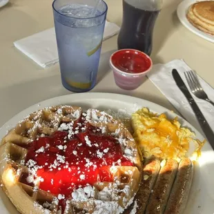 belgian waffles w. strawberries &amp; powdered sugar, scrambled eggs w. cheese, turkey sausage, and water w. 3 lemons