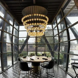 a dining room with a large chandelier