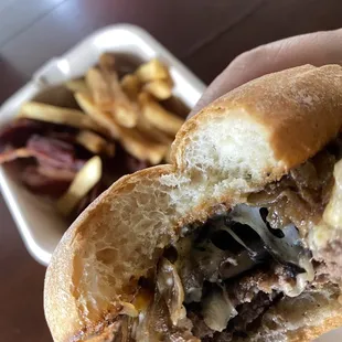 Fun guy mushroom burger with fries and bacon on the side.