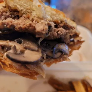 Lots of mushrooms...perfect for mushroom lovers...good burger...bun is grilled