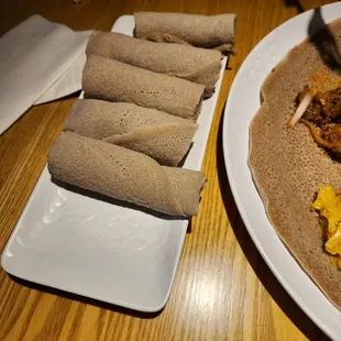 Three sponge bread roll ups per person