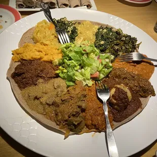 A vegetarian platter, a chicken platter and a lamb platter, which came with plenty of injera bread to soak it up.