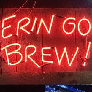 a neon sign that says ern go brew
