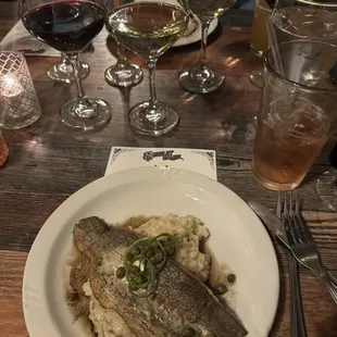a plate of fish and mashed potatoes