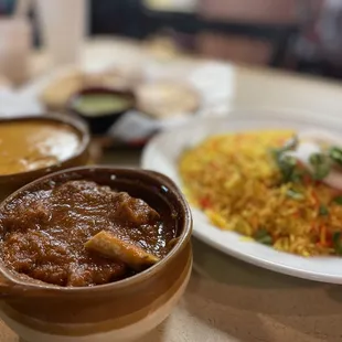 a plate of food and a bowl of rice