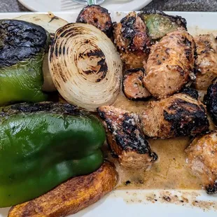 Tender shish tawook chicken in lemon-oregano sauce with lots of grilled vegetables.