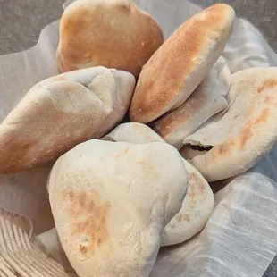 A lovely basket of delicious, puffy pita bread.