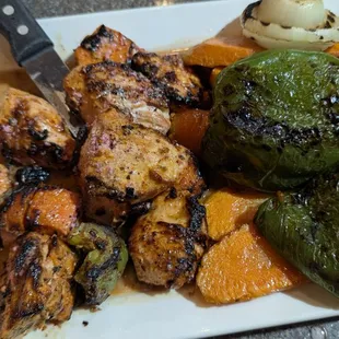 Tender, grilled shish tawook in a lemon-oregano sauce, with grilled vegetables. Along with the pita, salad, and baba, this is my happy meal.