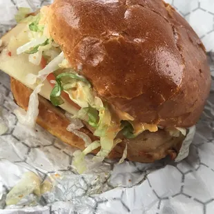 a sandwich wrapped in tin foil