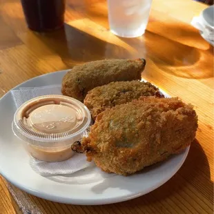 Armadillo eggs: brisket and cheese stuffed jalapeños!