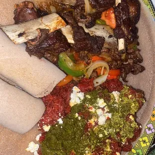 Goden Tibs : Beef prime Tibs, and Kitfo: Beef tar tar with Goman and Iab ( Collard greens finely chopped and Ethiopian Cheese on top)