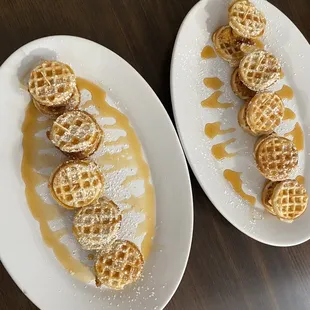 two plates of waffles on a table