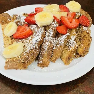 French toast topped with bananas and strawberries