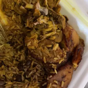 Curry chicken  Fried plantains Rice and peas   Being devoured