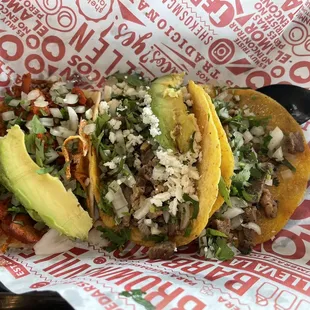 three tacos in a basket