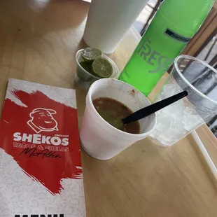 a menu and a cup of coffee