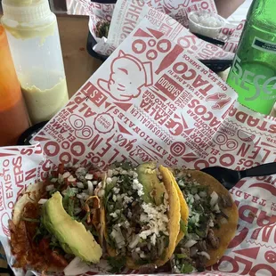 two tacos in a paper basket