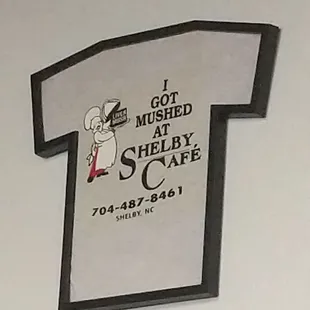 a t - shirt hanging on the wall