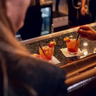 a bartender serving cocktails