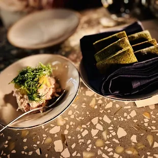 a plate of food and napkins on a table