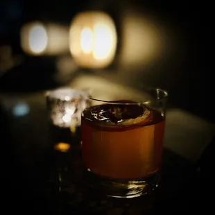 a shot of a drink in a glass on a table