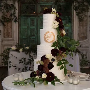 Four-tier wedding cake (floral provided by Jules Floral Designs)