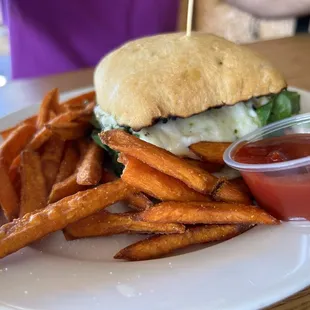 Grilled Basil Pesto Chicken Sandwich with sweet potato fries.