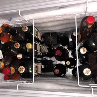 a cooler full of beer bottles