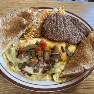 The Works omelette with a side of sausage patties