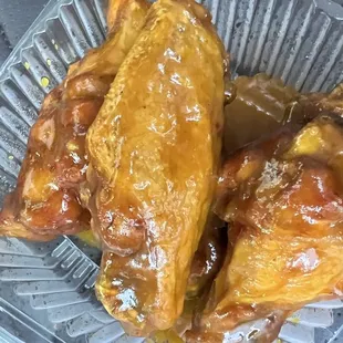 Glee wings. Not spicy. I do not like mustard, these were mustard based bbq. I dove in. So delicious! Thank you for recommending them.