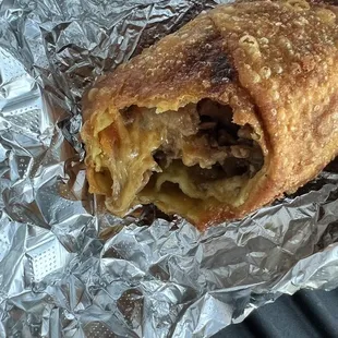 Philly steak egg roll. JUST GET IT!  Amazing.