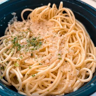 a bowl of pasta with parmesan cheese