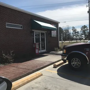 a truck parked in front of the store