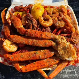 swamp platter  crab legs crawfish  shrimp potatoes corn