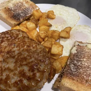 TRADITIONAL BREAKFAST WITH SAUSAGE, HASHBROWNS, TWO EGGS, AND TOAST