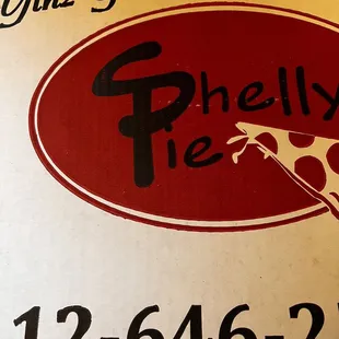 a pizza box with a slice taken out of it