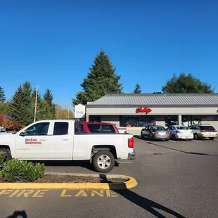 a white truck parked in a parking lot