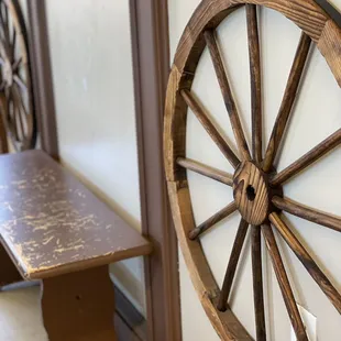 a wagon wheel and a bench