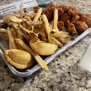 1lbs boneless wings, basket of fries with pirogies. Excellent choice for shared share