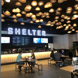 people sitting at tables in a restaurant