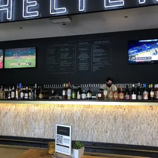 a bar with a lot of bottles of alcohol