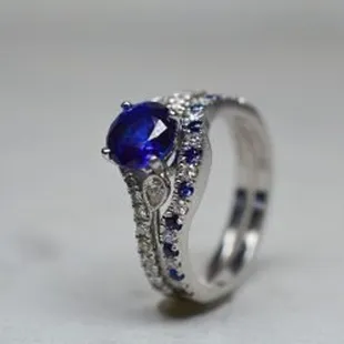 Something blue, blue sapphire and diamond ring with a center featuring a sapphire instead of a traditional diamond.