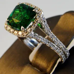 Extremely good quality and rare Zambian Emerald cushion cut 2.40cts and 102 round diamond in 18K white gold